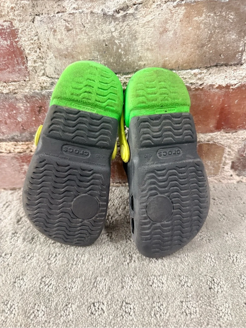 CROCS Kids Black Clog with Lime Green Footbed and Yellow Heel Strap